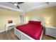 Bright bedroom with hardwood floors, tray ceiling and neutral-toned walls at 6713 Chester Trl, Bradenton, FL 34202
