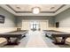 Billiards room with pool tables, decorative lighting, and neutral toned walls at 6713 Chester Trl, Bradenton, FL 34202