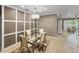Bright dining room features a modern chandelier and decorative wall trim at 6713 Chester Trl, Bradenton, FL 34202