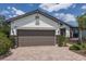 Charming one-story home with stone accents, two car garage, and meticulously maintained landscaping at 6713 Chester Trl, Bradenton, FL 34202