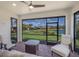 Covered lanai with brick flooring offering serene views of the community pond at 6713 Chester Trl, Bradenton, FL 34202