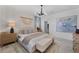 Elegant bedroom featuring a chic bed, trendy lighting, and coordinated decor for a relaxing atmosphere at 8134 Shore Lake Dr, Englewood, FL 34224