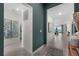 Inviting hallway with beige tile flooring, leading to a living area with a lake view and neutral décor at 8134 Shore Lake Dr, Englewood, FL 34224