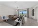 Bright living room with water view, neutral decor and stylish furnishings perfect for relaxation at 8134 Shore Lake Dr, Englewood, FL 34224