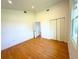 Bright bedroom features wood floors, closet space, and a window for natural light at 8297 Strasse Blvd, Punta Gorda, FL 33982