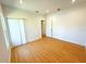 Spacious bedroom with wood floor, closet, and ample natural light create a comfortable retreat at 8297 Strasse Blvd, Punta Gorda, FL 33982