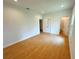 Bright bedroom with wooden floors, ensuite bathroom, and closet offer comfortable living at 8297 Strasse Blvd, Punta Gorda, FL 33982