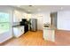 Modern kitchen with stainless steel appliances, granite countertops, and a breakfast bar at 8297 Strasse Blvd, Punta Gorda, FL 33982