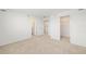 Clean bedroom featuring closet space and neutral carpeting, creating a cozy atmosphere at 8596 Lunar Skye St, Sarasota, FL 34241