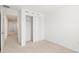Clean bedroom featuring closet space and neutral carpeting, creating a cozy atmosphere at 8596 Lunar Skye St, Sarasota, FL 34241
