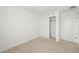 Clean bedroom featuring closet space and neutral carpeting, creating a cozy atmosphere at 8596 Lunar Skye St, Sarasota, FL 34241