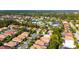 Serene aerial view of a residential community featuring tree lined streets and community water features at 9120 Willow Brook Dr, Sarasota, FL 34238