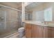 Well lit bathroom with tiled walk-in shower and double sink vanity with ample counter space at 9120 Willow Brook Dr, Sarasota, FL 34238
