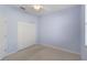 Neutral bedroom with wall-to-wall carpeting, ceiling fan, and closet with bi-fold doors at 9120 Willow Brook Dr, Sarasota, FL 34238