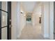 Grand foyer featuring tile flooring, arched doorways, and views of the pool area at 9120 Willow Brook Dr, Sarasota, FL 34238