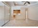 Bright living room with tile flooring, ceiling fan, and access to the kitchen at 9120 Willow Brook Dr, Sarasota, FL 34238