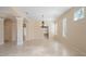 Spacious living room with tile flooring and arched doorways, perfect for entertaining at 9120 Willow Brook Dr, Sarasota, FL 34238