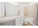 Bathroom featuring a large vanity, tiled shower, and modern fixtures at 10455 Wet Marsh Cv, Parrish, FL 34219
