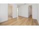 Bright bedroom with light wood flooring and two entryways at 10455 Wet Marsh Cv, Parrish, FL 34219