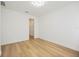 Bright bedroom with light wood flooring and walk-in closet at 10455 Wet Marsh Cv, Parrish, FL 34219