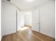 A bright bedroom with hardwood floors, two doors, and lots of natural light at 10455 Wet Marsh Cv, Parrish, FL 34219