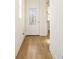 Bright entryway featuring a door with glass inserts and light hardwood flooring at 10455 Wet Marsh Cv, Parrish, FL 34219