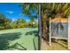 Well-kept basketball court with visible rules sign surrounded by trees at 12676 Sagewood Dr, Venice, FL 34293