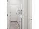 Well-lit laundry room with tile floors, washer, dryer, and convenient storage space at 12676 Sagewood Dr, Venice, FL 34293