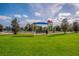 Community playground with slides, climbing structures, and covered seating at 12676 Sagewood Dr, Venice, FL 34293