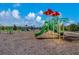 Community playground with slides, climbing structures, and covered seating at 12676 Sagewood Dr, Venice, FL 34293