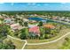 Aerial view of the neighborhood and property, including a pond at 12838 Daisy Pl, Bradenton, FL 34212