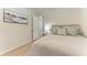 Cozy bedroom with hardwood floors, a comfy bed, and a peaceful ambiance at 12838 Daisy Pl, Bradenton, FL 34212