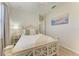 Inviting bedroom with a decorative bed frame, plush pillows, and soft lighting for a relaxing retreat at 12838 Daisy Pl, Bradenton, FL 34212