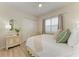 Cozy bedroom featuring neutral decor, window shutters, and a double-door closet at 12838 Daisy Pl, Bradenton, FL 34212