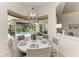 Charming breakfast nook with pool view, offering a cozy and bright dining space at 12838 Daisy Pl, Bradenton, FL 34212