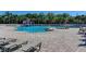 A resort-style community pool with a splash pad for and plenty of lounge chairs at 12838 Daisy Pl, Bradenton, FL 34212