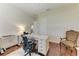A home office with hardwood floors, a modern desk, and a comfortable chair offers a functional workspace at 12838 Daisy Pl, Bradenton, FL 34212