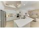 Modern white kitchen featuring sleek countertops, stainless steel appliances, and a spacious open design at 12838 Daisy Pl, Bradenton, FL 34212