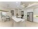 Bright kitchen with sleek countertops, white cabinetry, and modern appliances, perfect for culinary enthusiasts at 12838 Daisy Pl, Bradenton, FL 34212