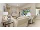 Inviting living room with comfortable seating, neutral decor, and sliding glass doors to the lanai at 12838 Daisy Pl, Bradenton, FL 34212