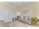 Living room featuring a ceiling fan, a neutral palette, and wood-look floors at 12838 Daisy Pl, Bradenton, FL 34212