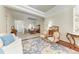 Open floor plan showcasing living room flowing into dining area, adorned with stylish furnishings and decor at 12838 Daisy Pl, Bradenton, FL 34212
