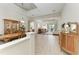 Open-concept living spaces with coffered ceilings, hardwood flooring, and dining areas for entertaining at 12838 Daisy Pl, Bradenton, FL 34212