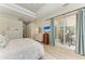 Light-filled main bedroom with en-suite access, tray ceiling and lanai access at 12838 Daisy Pl, Bradenton, FL 34212