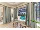 Bright sitting area with view of the pool and comfortable seating at 12838 Daisy Pl, Bradenton, FL 34212