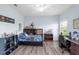 Bedroom with wood-look floors, neutral paint and filled with an assortment of toys at 13116 Bliss Loop, Bradenton, FL 34211