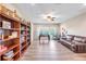 Expansive bonus room with foosball table, sofa and drumset for leisure and entertainment at 13116 Bliss Loop, Bradenton, FL 34211