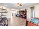 Spacious bonus room with ceiling fan, a bookshelf, a desk, and a foosball table at 13116 Bliss Loop, Bradenton, FL 34211