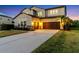 Elegant two-story home with well-maintained landscaping, a two-car garage, and a spacious driveway at 13116 Bliss Loop, Bradenton, FL 34211