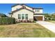 Beautiful two-story home with well-maintained landscaping, a two car garage, and a spacious driveway at 13116 Bliss Loop, Bradenton, FL 34211